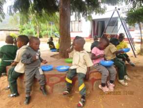 Kids At Our Preschool Eating Porridge