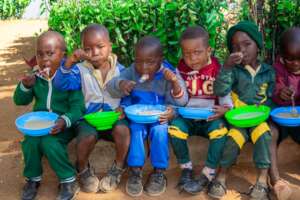 Kids At Our Primary School Eating Porridge