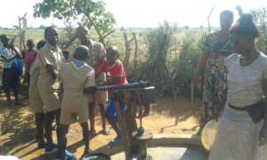 Scouts Helping Women Plant Vegetables