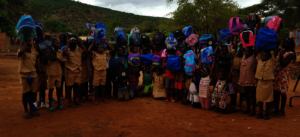 Kids Receiving Backpacks