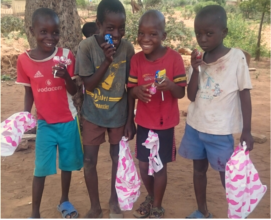 Kids All Smiles After Receiving Christmas Gifts