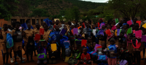 Kids Receiving Notebooks