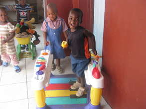 Kids who attend our pre-school playing with toys