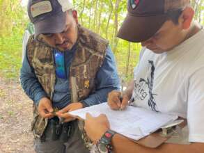 Recording bird data. Photo by Jerry Maryniuk