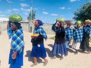 Farmers show off their harvest.