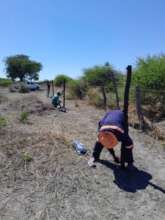 Farmers & EfA working together to erect the fence