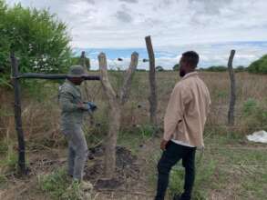 Teams inspect the completed fence for any faults