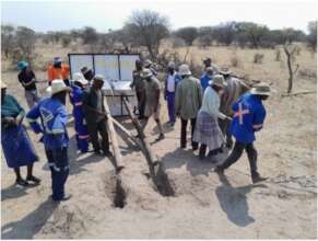 Erecting the solar panels that power the fence