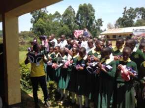 Girls showing out their dignity packs