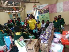 Giving out pants to the girls