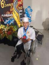 Use new wheelchair in his graduation