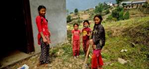 Children are cleaning up their learning center.