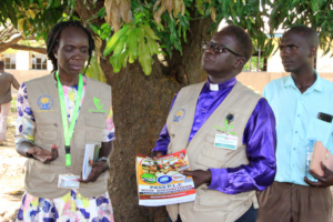 The board chairperson distributing books in school