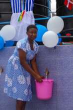 A beneficiary seen fetching water
