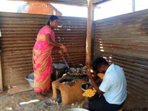 Lakshmi cooking murukku at her home