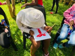 Participant immersed in painting her life's story