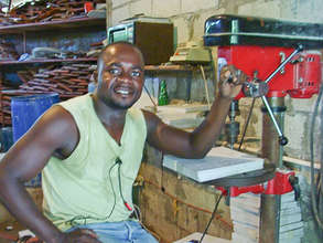 Employee working at drill press