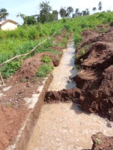 Trenches filled with water due to rainfall.