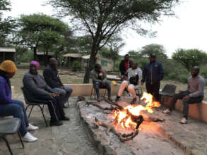 Discussions and singing at the boma