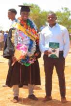 Steven poses for a photo during his graduation