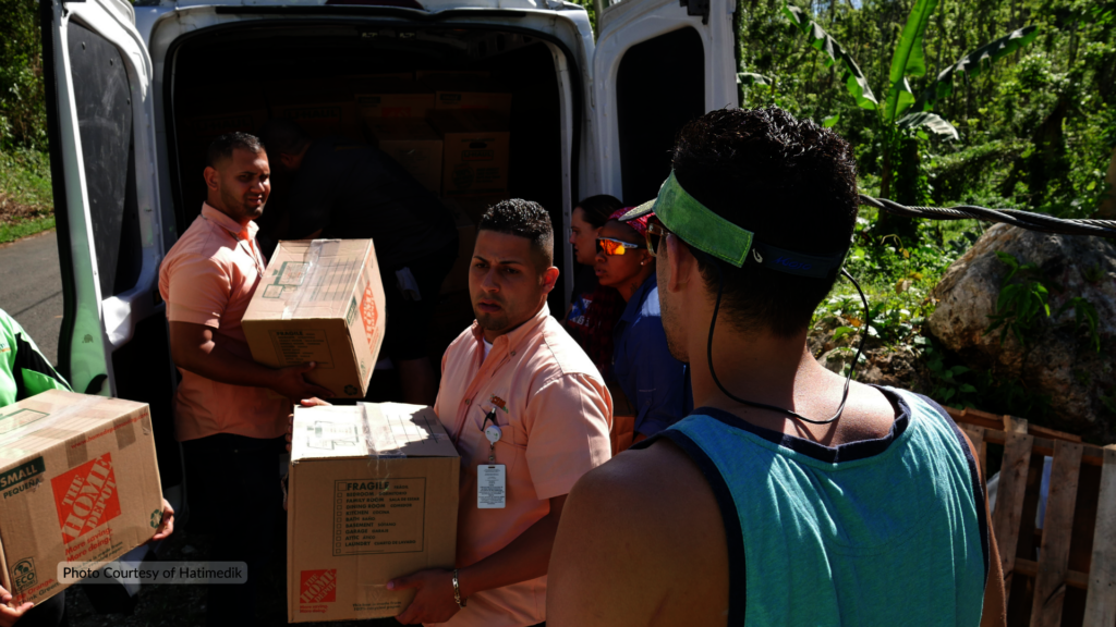 Workers drop off supplies after Hurricane Maria
