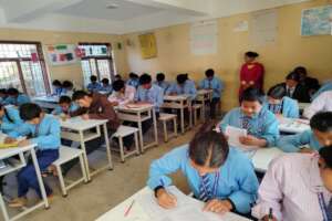 Teacher guides students in active classroom work