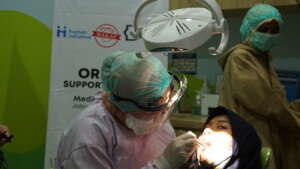 Doctor provides pediatric dental care