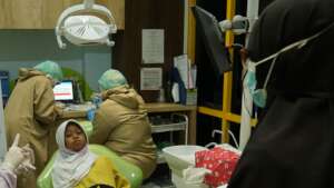 Child prepares for dental treatment
