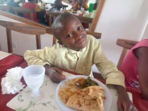Emmanuel eating at WOW Cafe