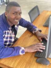 Hussein taking computer classes by WOW Tanzania