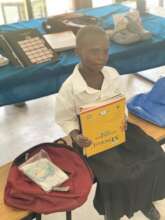 Aziza getting school books and uniform from WOW