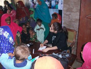 Dr. Sarah checking patients in medical camp