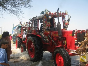 Tractor & trolly crossing flood water road