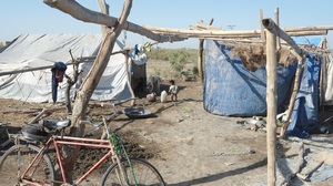 villagers living in distroyed shelter