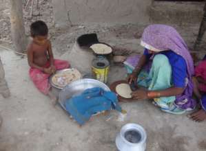 women making chapati for her family