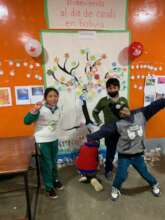 Kids in front of the mural made on 'Canada Day'