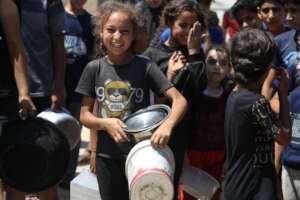A young child at a hot meal distribution