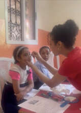 Dental volunteer with children at the clinic