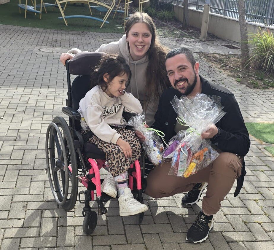 Chimes Child and Parent on with Purim Gift
