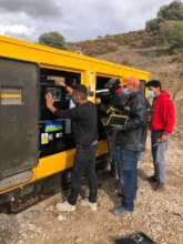 Technical team fixing the generator