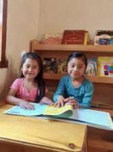 Girls enjoying reading together