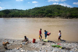 People carring water of the overflowing river