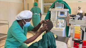 Uganda eye doctor at wok in government hospital