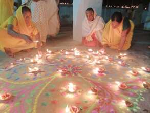Rangoli and diya decoration at the entrance