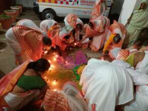 Each mother lights a candle on Diwali @Ashram