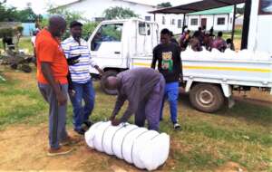 Unloading nets before distribution in rural Zambia