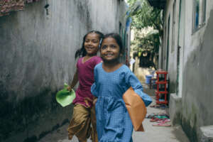 Students playing in front of their preschool