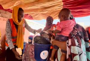 SIHA Staff distributing Kits