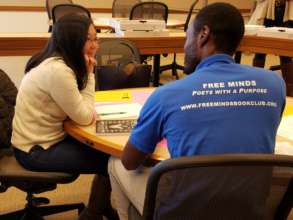 Hosea speaks with a student at Harvard Law School
