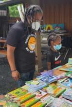 Poet Ambassador Shannon with a young reader